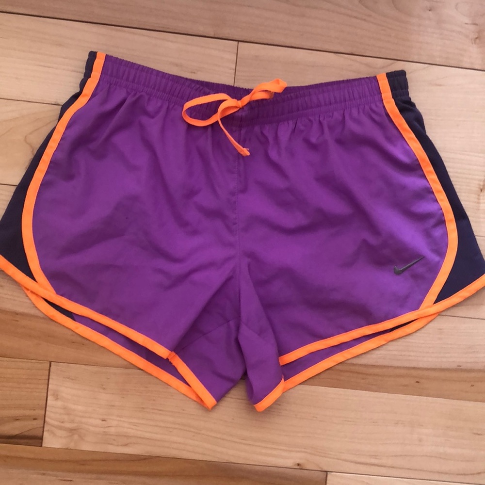 purple, orange, and grey nike tempo shorts